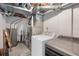 Basement laundry room featuring a new washer and dryer with open ductwork and mechanicals at 4793 S Swadley St, Morrison, CO 80465