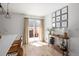 Bright dining area with sliding glass doors and a stylish console table with decor at 4793 S Swadley St, Morrison, CO 80465
