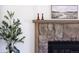 Close up on a stone fireplace with decorative mantel and hearth at 4793 S Swadley St, Morrison, CO 80465