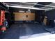 Finished garage featuring slat wall, work-out area and storage at 4793 S Swadley St, Morrison, CO 80465