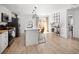 Bright kitchen features a center island with seating and modern stainless steel appliances at 4793 S Swadley St, Morrison, CO 80465