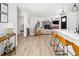 Open-concept living space featuring a kitchen, living room and modern finishes at 4793 S Swadley St, Morrison, CO 80465