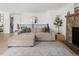 Spacious living room featuring a large sectional couch and stone fireplace at 4793 S Swadley St, Morrison, CO 80465