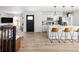 Open-concept space with a modern kitchen, living area, and ample natural light at 4793 S Swadley St, Morrison, CO 80465