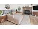 Bright living room with a large sectional, stone fireplace, and decorative accents at 4793 S Swadley St, Morrison, CO 80465