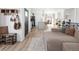 Open floor plan with a modern living room, kitchen, and stylish furnishings at 4793 S Swadley St, Morrison, CO 80465