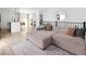 Open-concept living space with a large sectional couch and dining area at 4793 S Swadley St, Morrison, CO 80465