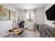 Bright office space features a large window, modern decor, and wood flooring at 4793 S Swadley St, Morrison, CO 80465