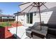Cozy outdoor patio area with comfortable seating and lighting, perfect for entertaining at 4793 S Swadley St, Morrison, CO 80465