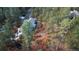 Breathtaking aerial view of mountain home nestled among mature trees on a private lot at 226 Hidden Valley Ln, Castle Rock, CO 80108