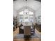 Dining room with a table, large window, chandelier, and decoratively painted neutral-colored walls at 226 Hidden Valley Ln, Castle Rock, CO 80108
