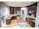 Spacious kitchen with dark cabinetry, a large island, and stainless steel appliances at 226 Hidden Valley Ln, Castle Rock, CO 80108