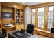 Bright office featuring built-in wooden shelves, a built-in window seat, and a gray office desk at 226 Hidden Valley Ln, Castle Rock, CO 80108