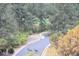 Scenic neighborhood road with deer crossing in a wooded residential area at 226 Hidden Valley Ln, Castle Rock, CO 80108
