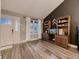 Bright living room with a large window, modern flooring, and a decorative accent wall at 19772 Centerville Ct, Parker, CO 80134