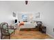 Bright bedroom with hardwood floors and a large window at 9240 W 49Th Ave # 317, Wheat Ridge, CO 80033