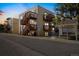 A night view of the condominiums with well-maintained grounds and classic architecture at 9240 W 49Th Ave # 317, Wheat Ridge, CO 80033