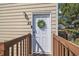 Charming front door with a decorative wreath, complemented by natural wood accents at 9240 W 49Th Ave # 317, Wheat Ridge, CO 80033