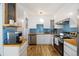Bright kitchen features white cabinets, stainless steel appliances, and light wood countertops at 9240 W 49Th Ave # 317, Wheat Ridge, CO 80033