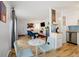 Open-concept view of the combined living, dining, and kitchen area creating a welcoming flow at 9240 W 49Th Ave # 317, Wheat Ridge, CO 80033