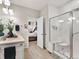 Bright bathroom with a glass shower door and a sink with a marble countertop at 4538 Hidden Gulch Rd, Castle Rock, CO 80104