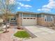 Charming home with stone accents, a well-manicured yard, and a spacious two-car garage at 4538 Hidden Gulch Rd, Castle Rock, CO 80104