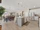 Open concept kitchen featuring white cabinetry, stainless appliances, and a large center island at 4538 Hidden Gulch Rd, Castle Rock, CO 80104
