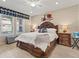Comfortable main bedroom featuring a ceiling fan and large windows with natural light at 4538 Hidden Gulch Rd, Castle Rock, CO 80104