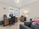 Functional home office with natural light and a comfortable seating area at 4538 Hidden Gulch Rd, Castle Rock, CO 80104