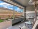 Covered outdoor patio area with patio seating and views of a hillside at 4538 Hidden Gulch Rd, Castle Rock, CO 80104