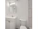 Clean basement bathroom with white vanity, toilet, and shower at 932 S Dearborn Way # 8, Aurora, CO 80012