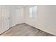 Bright bedroom with neutral walls and wood-look flooring at 932 S Dearborn Way # 8, Aurora, CO 80012