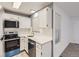 Kitchen with stainless steel appliances and white cabinets at 932 S Dearborn Way # 8, Aurora, CO 80012
