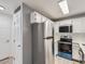 Kitchen with stainless steel appliances and white cabinets at 932 S Dearborn Way # 8, Aurora, CO 80012