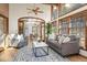 Bright living room featuring hardwood floors, fireplace, and floor to ceiling windows at 5274 Idylwild Trl, Boulder, CO 80301