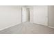 Carpeted bedroom features closet with sliding doors, and ample natural light at 8879 Sedalia St, Commerce City, CO 80022