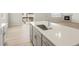 Bright kitchen island featuring a sink with a modern faucet and stainless steel appliances at 8879 Sedalia St, Commerce City, CO 80022
