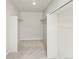Spacious walk-in closet with carpet and shelving, perfect for organizing clothes and accessories at 8879 Sedalia St, Commerce City, CO 80022