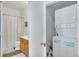 Cozy bathroom featuring a shower-tub combo and a convenient in-unit laundry setup at 2428 W 82Nd Pl # 3A, Westminster, CO 80031