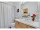 Clean bathroom featuring a vanity, shower curtain, and functional layout at 2428 W 82Nd Pl # 3A, Westminster, CO 80031