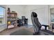 Comfortable and bright bedroom space with custom bookshelves and a modern computer setup at 2428 W 82Nd Pl # 3A, Westminster, CO 80031