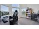 Bright bedroom with natural light streaming through large windows, creating a tranquil workspace at 2428 W 82Nd Pl # 3A, Westminster, CO 80031