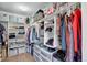 Organized walk-in closet with custom shelving, drawers, and ample storage space at 2428 W 82Nd Pl # 3A, Westminster, CO 80031