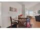 Cozy dining area with hardwood floors, stylish furniture, and bright natural light at 2428 W 82Nd Pl # 3A, Westminster, CO 80031