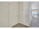 Exterior shot of secure apartment doors with white siding, offering privacy and safety at 2428 W 82Nd Pl # 3A, Westminster, CO 80031