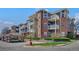 Inviting brick condo building featuring balconies and well-maintained landscaping at 2428 W 82Nd Pl # 3A, Westminster, CO 80031