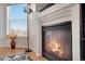Close up of a warm fireplace with a sleek black trim and beautiful natural light at 2428 W 82Nd Pl # 3A, Westminster, CO 80031