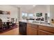 Kitchen featuring essential appliances and a view into the adjacent living area at 2428 W 82Nd Pl # 3A, Westminster, CO 80031