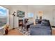 Bright living room with hardwood floors, a cozy fireplace, and plenty of natural light at 2428 W 82Nd Pl # 3A, Westminster, CO 80031