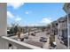 Scenic view from an apartment balcony overlooking the parking lot, the road and nearby landscape at 2428 W 82Nd Pl # 3A, Westminster, CO 80031